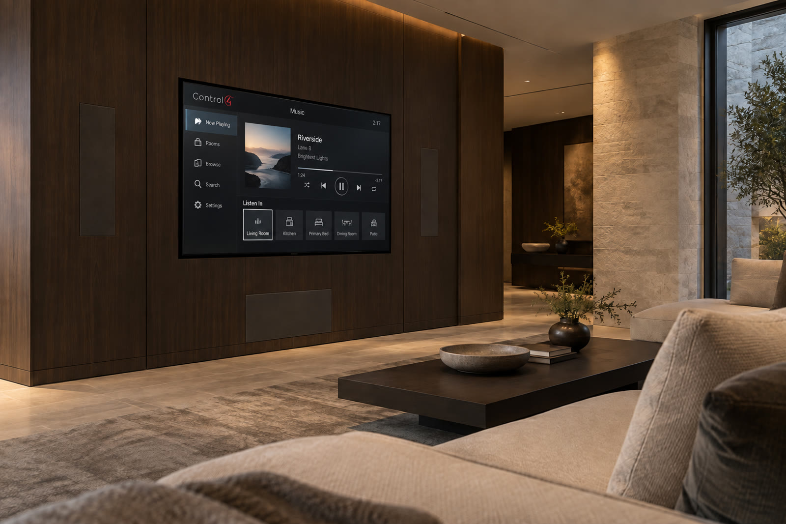 Luxury media room with Control4 on the television and audio built into a dark wood wall
